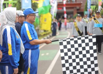 Pj. Wali Kota Bekasi Sambut Antusias Lomba Gerak Jalan Kolaborasi dengan Bank BJB